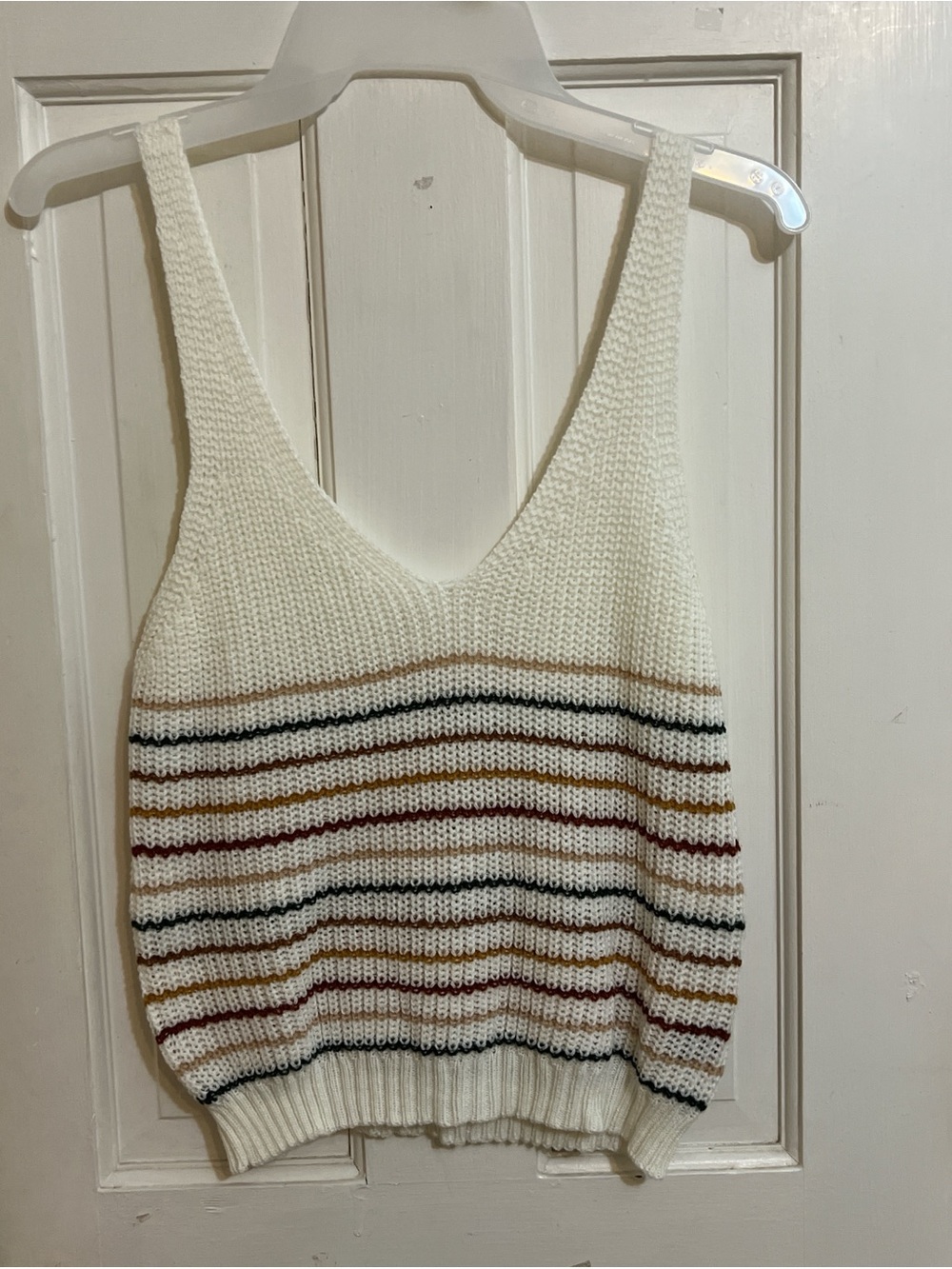 sleeveless striped knit top in ivory.